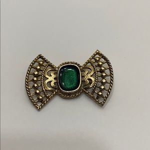 Gold tone bow tie brooch